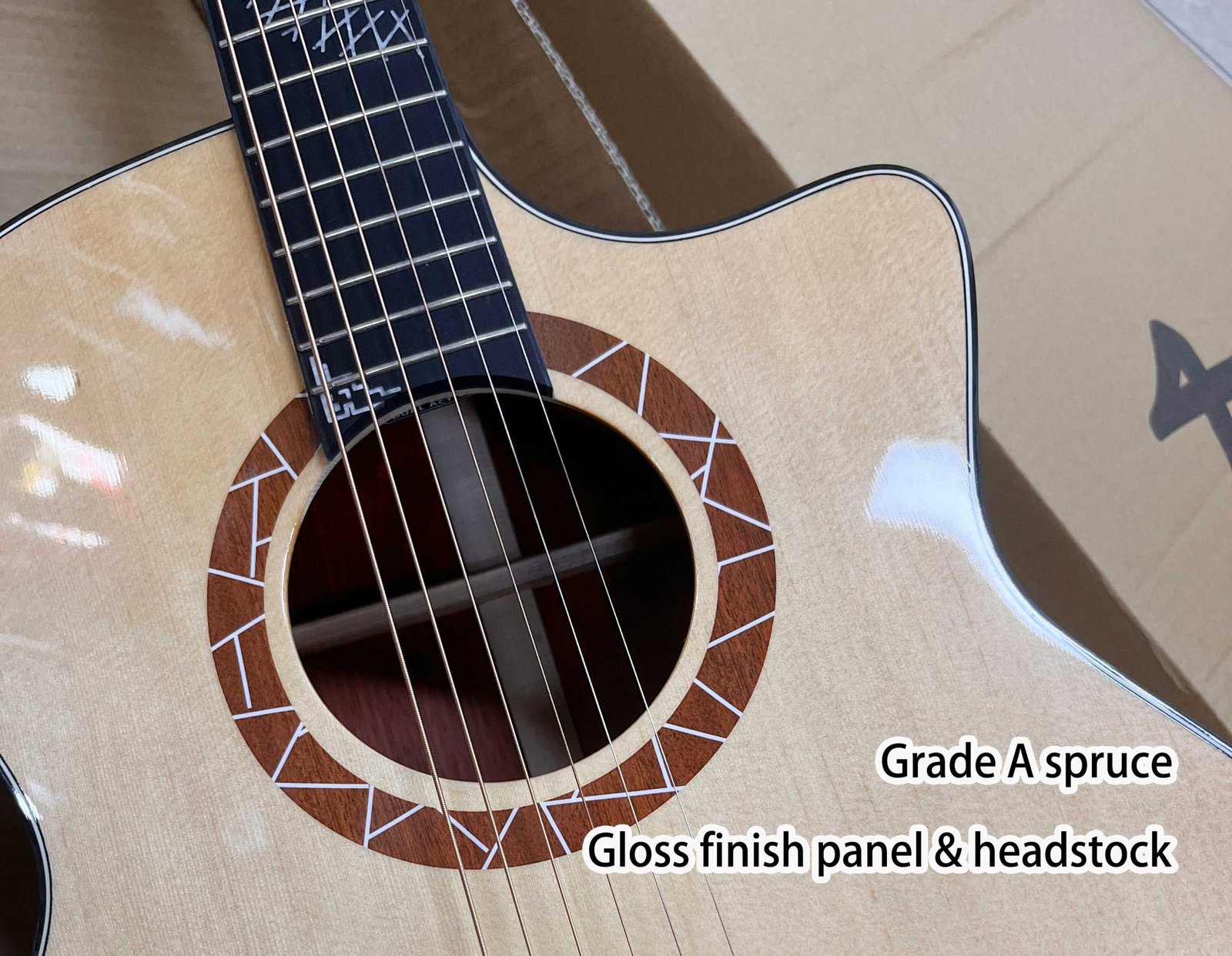 Close view of LuxarsMusic acoustic guitar body and finish details