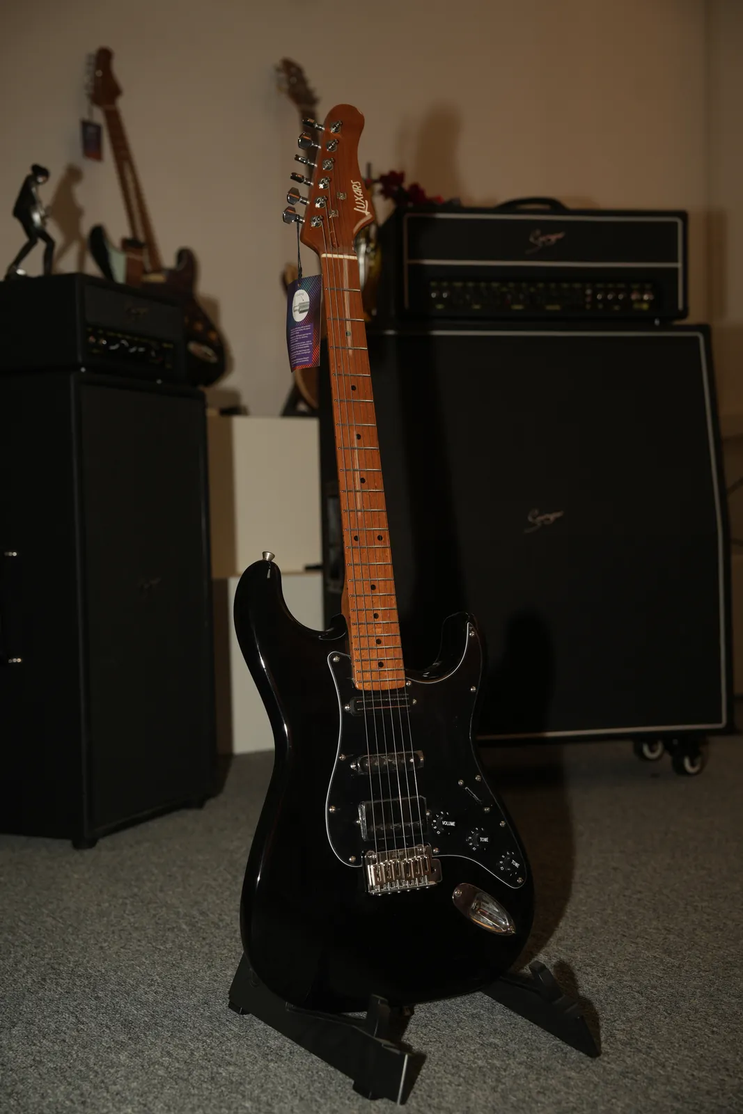 Luxars electric guitar showing controls and parts relevant to packaging